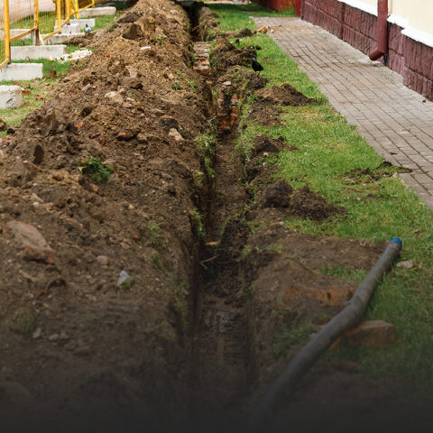 Drainage system trench with a visible hose and pipe installed in Louisville, KY