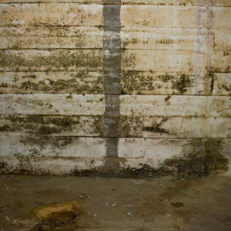 Basement Wall with Visible Cracks and Water Damage in Louisville, KY