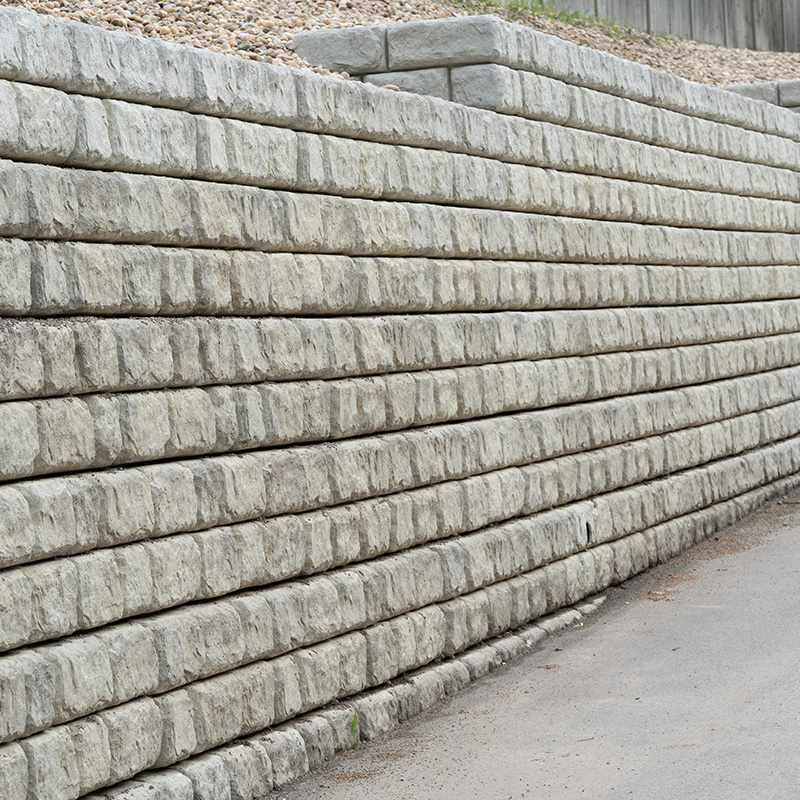 Stone Retaining Wall with Layered Concrete Blocks In Louisville, KY