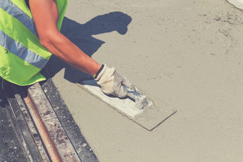 A person leveling a concrete slab by Case Foundation Systems in Louisville and Lexington, KY